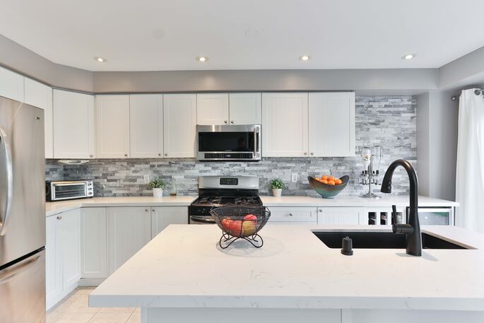 Kitchen with Appliances that will eventually need to be disposed of